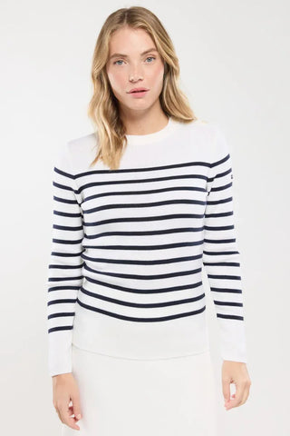 Woman wearing a navy and white striped long sleeve sweater, casual fashion style