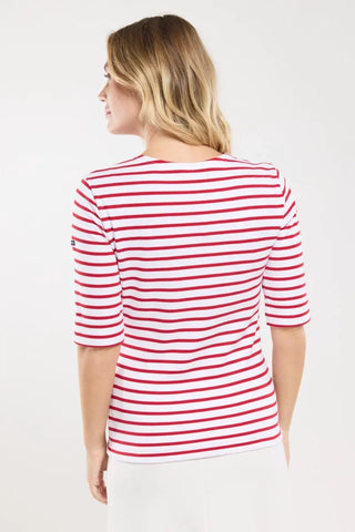 Woman wearing white and red striped nautical shirt, elbow-length sleeves, back view