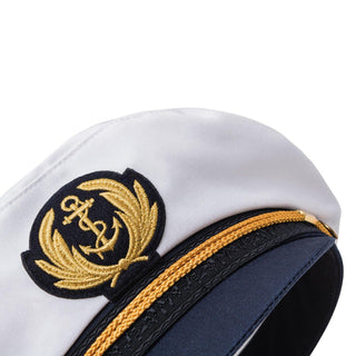 white and navy blue captain's hat with gold embroidered anchor emblem and trim