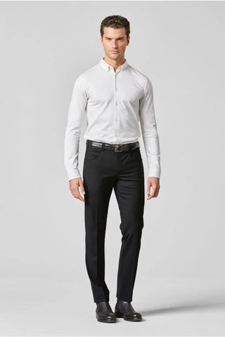 Man wearing a white dress shirt, black dress pants, leather belt and black shoes