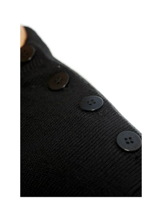 Close-up of black wool sweater shoulder with black buttons, men's knitwear detail