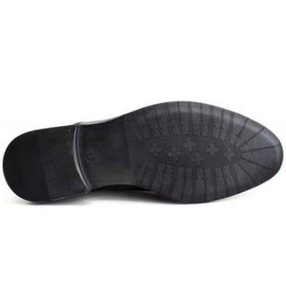 Close-up of black dress shoe sole with textured rubber grip, men's footwear detail