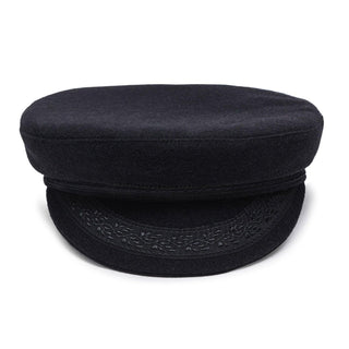 Black wool captain's hat with embroidered visor on white background