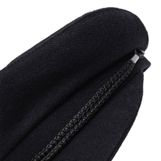 Close-up of a black wool captain hat with braided trim detail