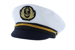 White and navy blue captain's hat with gold anchor emblem and braided gold trim