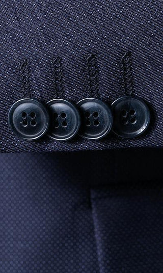 Close-up of navy wool suit sleeve with four dark buttons, men's formalwear detail