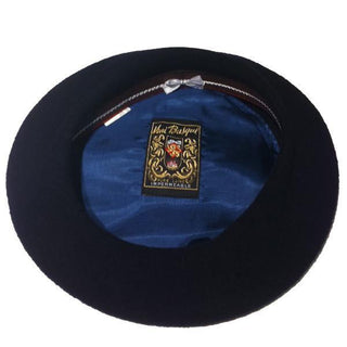 Black Basque beret with blue satin lining and decorative interior label