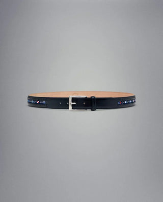 Black leather belt with silver buckle and nautical flag designs on a plain background