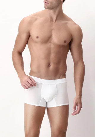 Man wearing white push-up boxer briefs, fitted cut, standing against a plain background