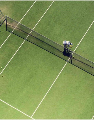 Boxer shorts with aerial tennis court print, person picking up tennis balls.
