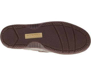 Brown rubber sole of a men's Sperry boat shoe with non-marking tread and logo detail