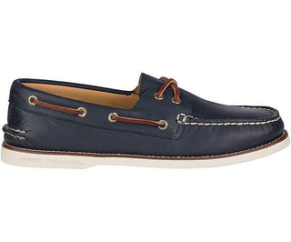 Men's navy leather boat shoe with white sole and brown laces, side profile