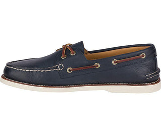 Men’s navy leather boat shoe with white stitching, brown laces and rubber sole