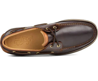 Men's brown leather boat shoe with gold eyelets and lace detail, top view