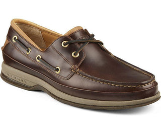 Men's brown leather 2-eye boat shoe with tan sole and gold eyelets